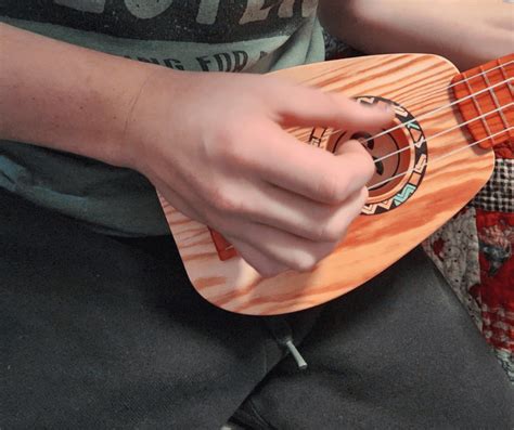 Is Ukulele Easier Than Guitar: A Symphony of Simplicity and Strings