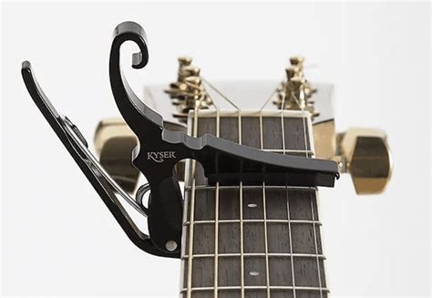 Whats a guitar capo and why does it make your guitar sound like a tiny orchestra?